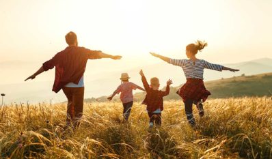 family running in a field